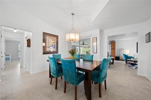 dining space with ceiling fan, vaulted ceiling, and light tile patterned floors