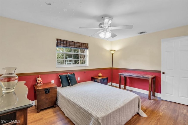 bedroom featuring hardwood / wood-style flooring and ceiling fan