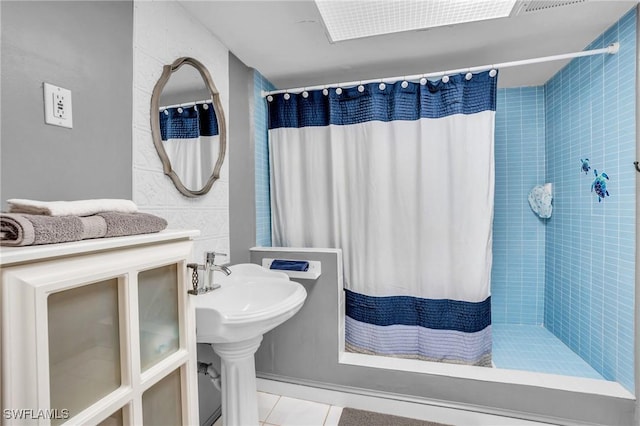 bathroom featuring tile patterned flooring and walk in shower