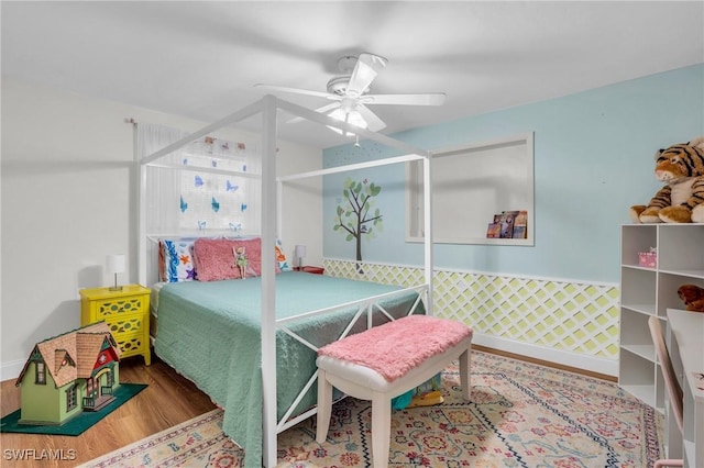 bedroom with hardwood / wood-style flooring and ceiling fan