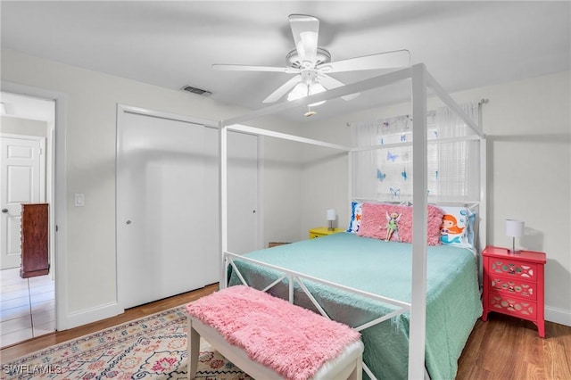 bedroom with hardwood / wood-style flooring and ceiling fan