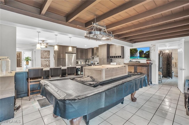 recreation room featuring exterior kitchen, ceiling fan, and a patio area