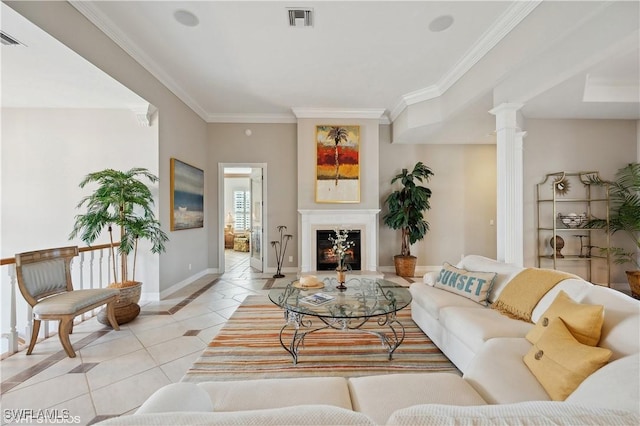 tiled living room featuring ornamental molding and decorative columns