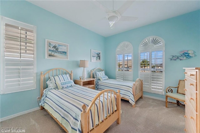 bedroom with light carpet and ceiling fan