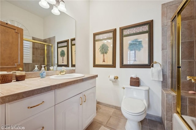 full bathroom with shower / bath combination with glass door, tile patterned flooring, vanity, a notable chandelier, and toilet