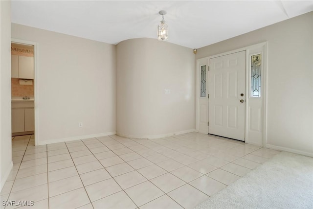 foyer entrance featuring light tile patterned floors