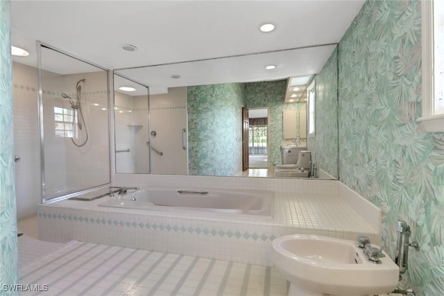 bathroom with independent shower and bath and a bidet