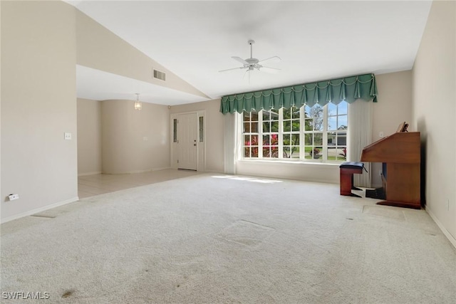 carpeted empty room featuring lofted ceiling and ceiling fan