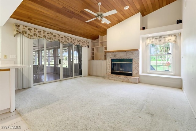 unfurnished living room with high vaulted ceiling, light colored carpet, wooden ceiling, ceiling fan, and a fireplace