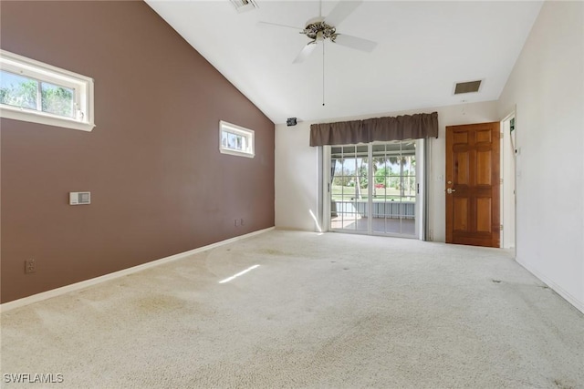 carpeted empty room featuring high vaulted ceiling and ceiling fan