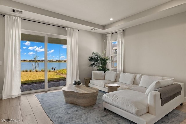 living room featuring a water view