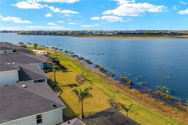 birds eye view of property with a water view