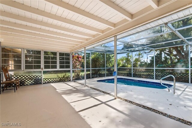 outdoor pool featuring a patio and a lanai