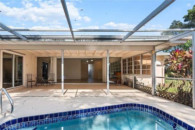 pool featuring a lanai and a patio