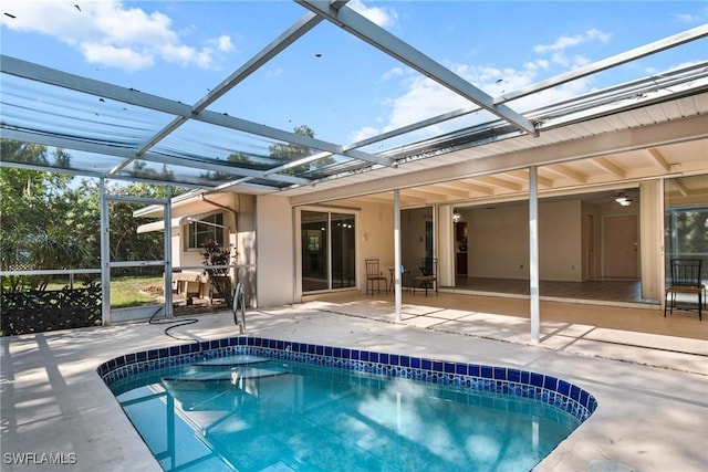 outdoor pool featuring a lanai and a patio