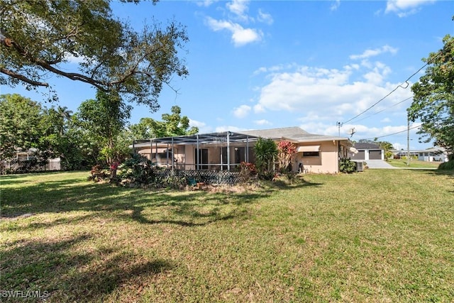 view of yard with a lanai