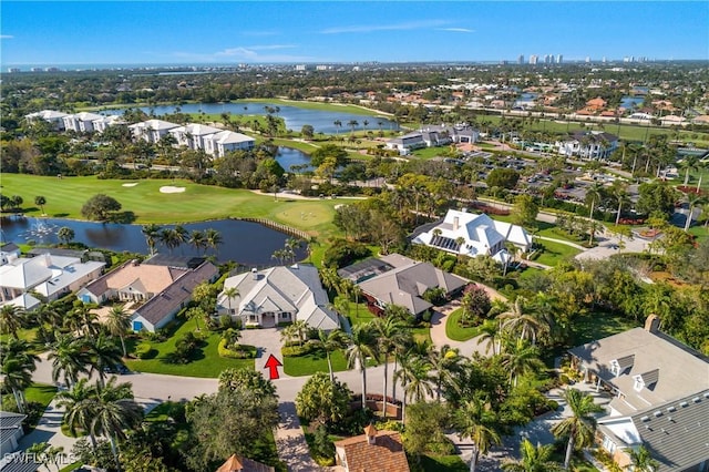 birds eye view of property featuring a residential view, view of golf course, and a water view