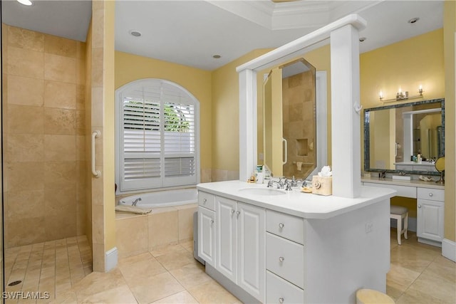 full bathroom featuring a bath, tiled shower, vanity, and tile patterned floors