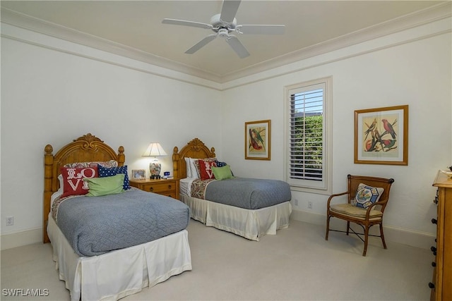 bedroom featuring light carpet, baseboards, ornamental molding, and ceiling fan