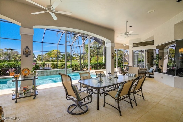 view of patio / terrace with ceiling fan, a lanai, and an outdoor pool