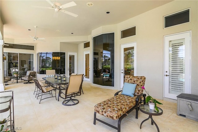 view of patio with ceiling fan and outdoor dining space