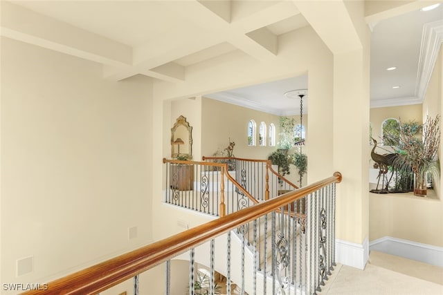 hall featuring ornamental molding, light carpet, a notable chandelier, and beam ceiling