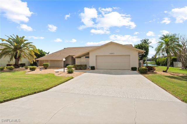 view of front of home with a front lawn and a garage