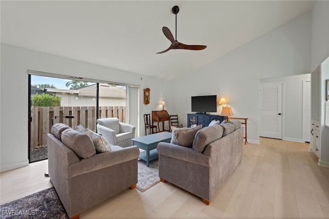 living room featuring light wood-type flooring, high vaulted ceiling, and ceiling fan