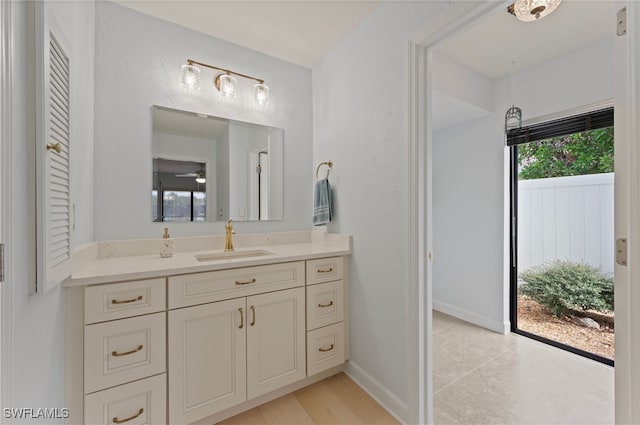 bathroom with vanity and ceiling fan