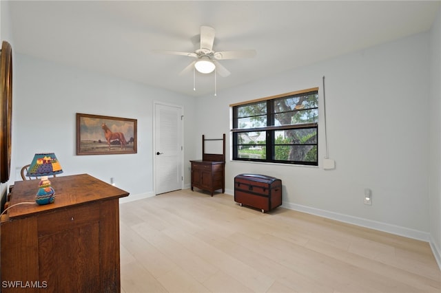 interior space with ceiling fan and light hardwood / wood-style floors