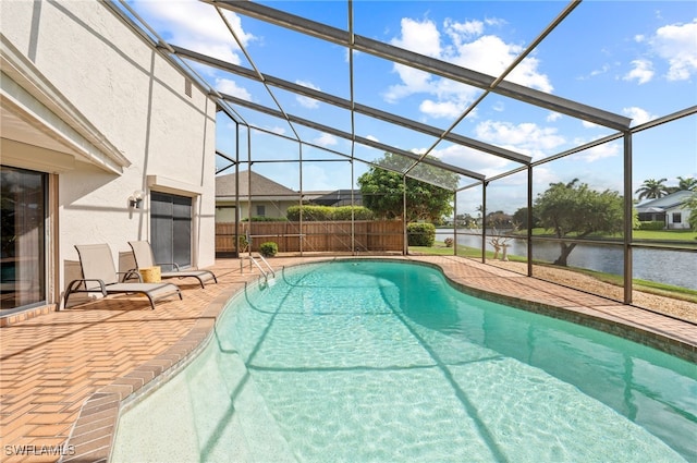 view of swimming pool featuring a water view, glass enclosure, and a patio