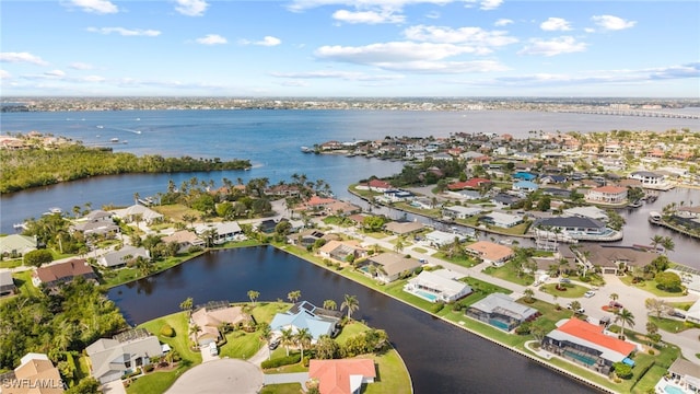 birds eye view of property featuring a water view