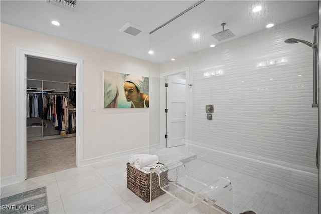 bathroom with tile patterned flooring, visible vents, and walk in shower