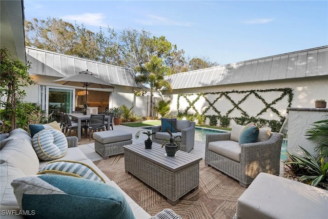 view of patio with outdoor dining space and outdoor lounge area