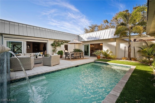 view of pool with a patio and an outdoor hangout area