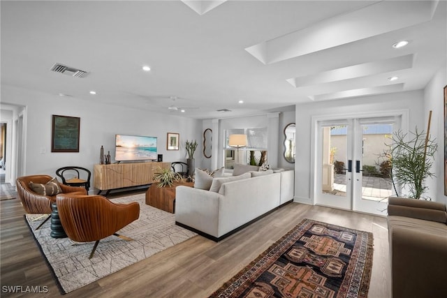 living room featuring hardwood / wood-style flooring and french doors