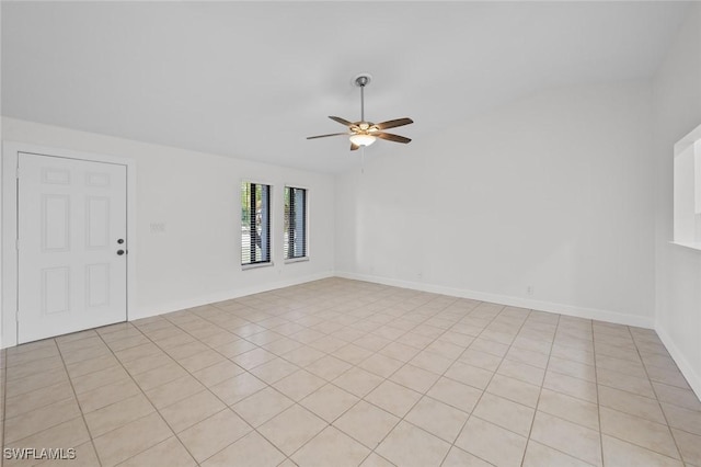 spare room with ceiling fan and vaulted ceiling