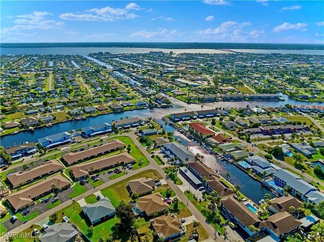 bird's eye view featuring a residential view and a water view