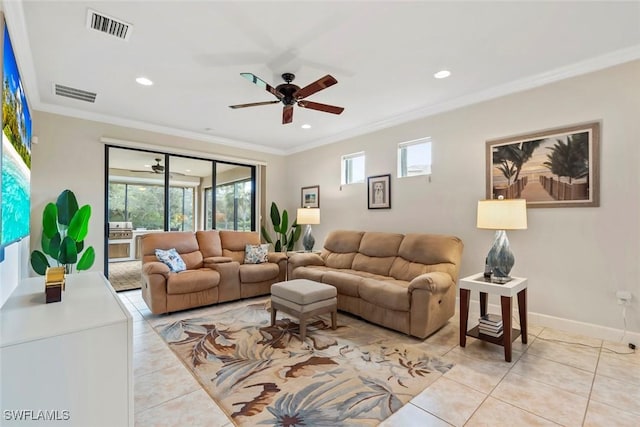 living room featuring ornamental molding, light tile patterned floors, and ceiling fan