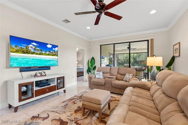 living room featuring ornamental molding, light tile patterned floors, and ceiling fan