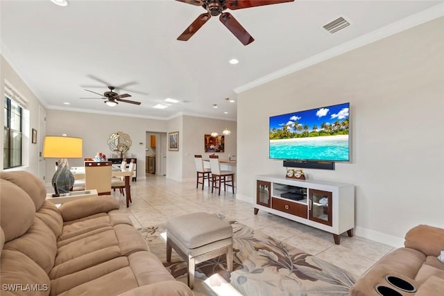 tiled living room featuring ceiling fan and ornamental molding