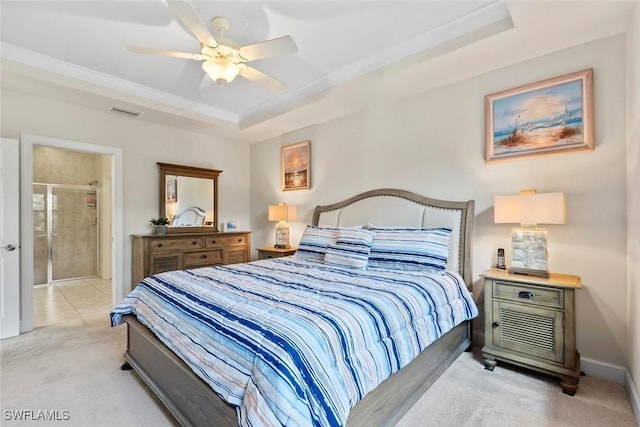 bedroom with light carpet, ornamental molding, a raised ceiling, and ceiling fan