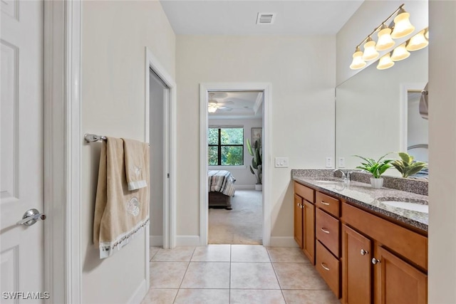 bathroom with tile patterned flooring and vanity