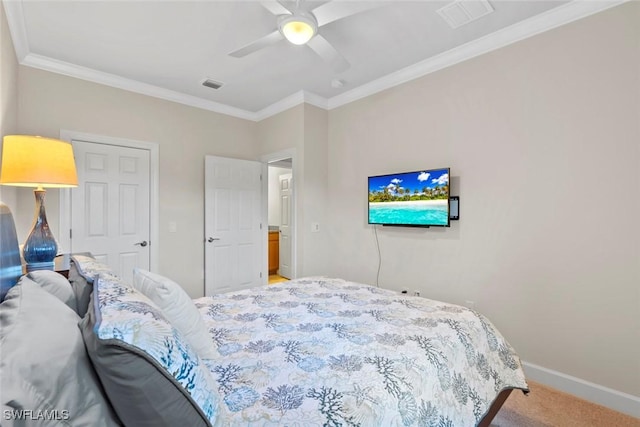 bedroom with crown molding, ceiling fan, and carpet