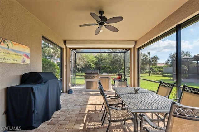 sunroom / solarium with ceiling fan