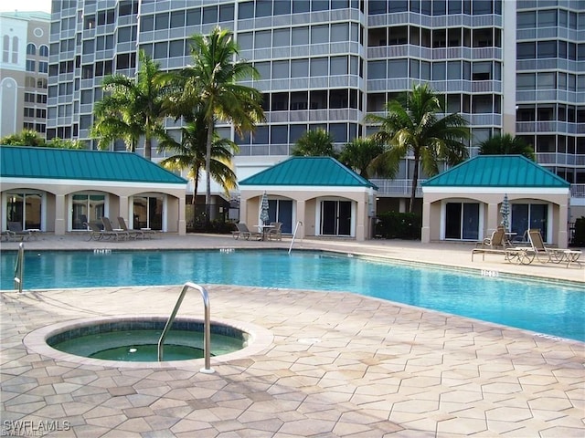 view of pool with a gazebo, a patio area, and a community hot tub