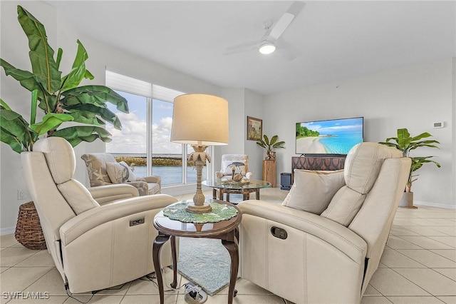 tiled living room with ceiling fan