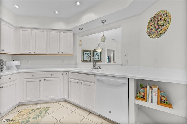 kitchen with white cabinetry, sink, hanging light fixtures, light tile patterned floors, and white dishwasher