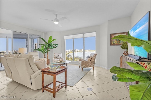 tiled living room featuring ceiling fan