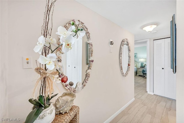 corridor featuring light hardwood / wood-style floors